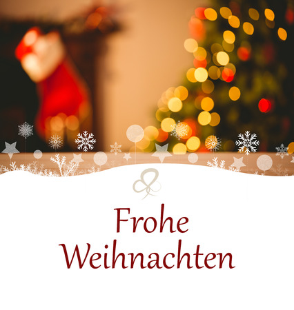 tree spiral against desk with christmas tree in backgroundの写真素材