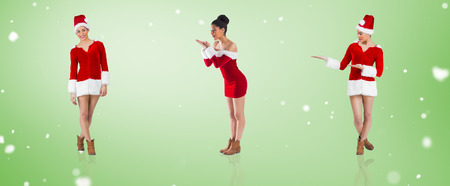 Composite image of different festive brunettes against green vignetteの写真素材