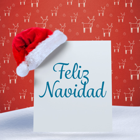 Feliz navidad against red reindeer patternの写真素材