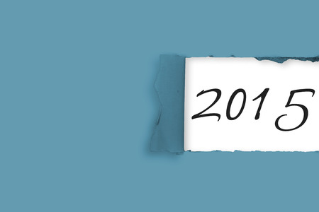 Rip in paper against 2015 in grey