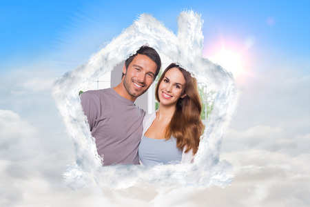 Parents in front of their family against blue sky with white cloudsの写真素材