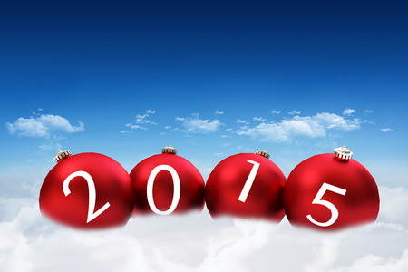 2015 against bright blue sky over clouds