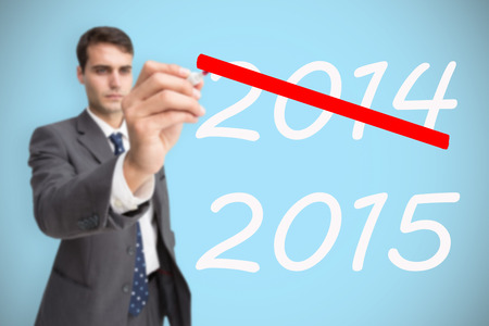 Concentrated businessman holding red marker against blue background with vignette