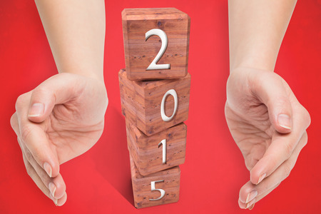 Hands presenting  against red backgroundの写真素材