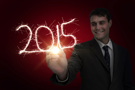 Businessman touching spark against red background with vignette