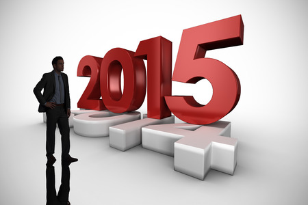 Businessman standing against white background with vignetteの写真素材