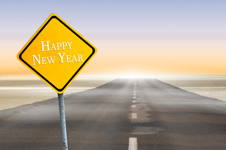 Happy new year against roadの写真素材