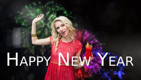 Blonde drinking cocktail against colourful fireworks exploding on black background