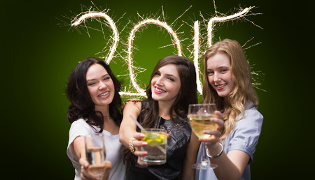 Friends with drinks against green background with vignette