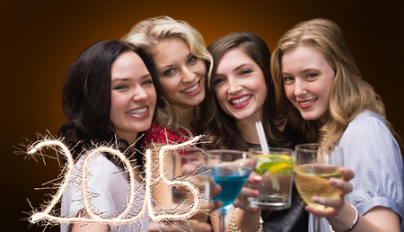 Friends with drinks against orange background with vignette