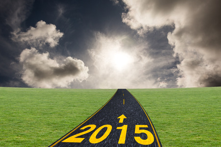 Orange triangle against dark sky with white cloudsの写真素材