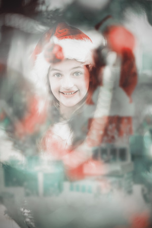 Composite image of composite image of jolly santa smiling at cameraの写真素材