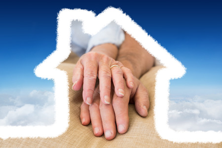 House outline against blue sky over cloudsの写真素材