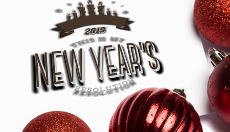 New years resolution against red christmas baubles