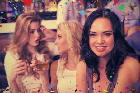 Pretty friends having a drink together against flying colours