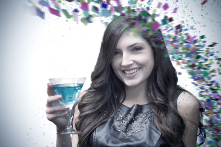 Brunette with cocktail against colour curveの写真素材