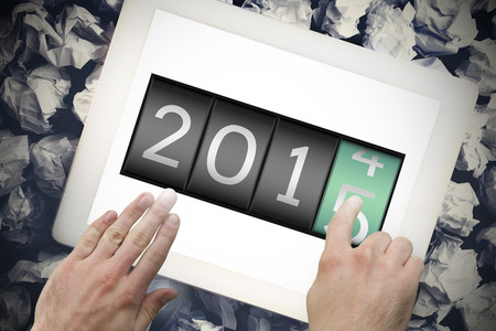 2014 changing to 2015 against hands touching tablet screenの写真素材
