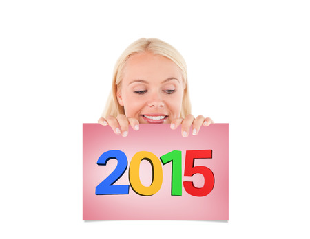 Woman peeking over a whiteboard against pink card