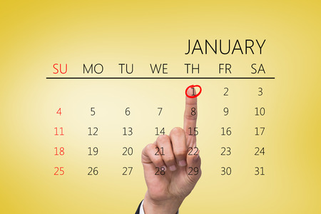 Hand pointing against yellow vignetteの写真素材