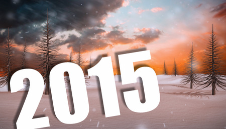 2015 against snowy landscape with fir trees