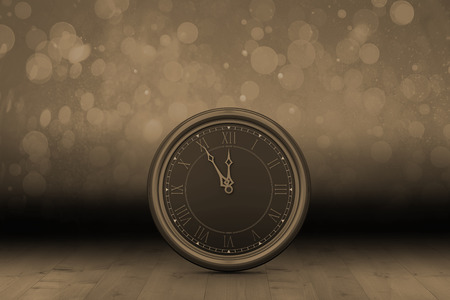 Large clock against shimmering light design over boardsの写真素材