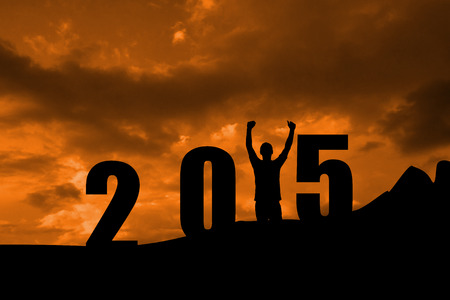 Cheering male silhouette against cloudy skyの写真素材