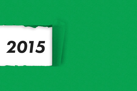 Rip in paper against 2015 in greyの写真素材