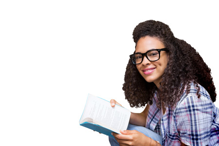 Student reading book in library  against white background with vignette