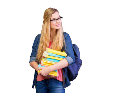 Pretty student in the library against white background with vignetteの写真素材