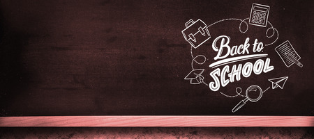 back to school against blackboard on wall