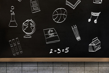 School doodles against blackboard on wallの写真素材