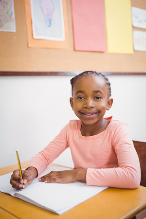 Smiling student looking at camera at the elementary schoolの写真素材