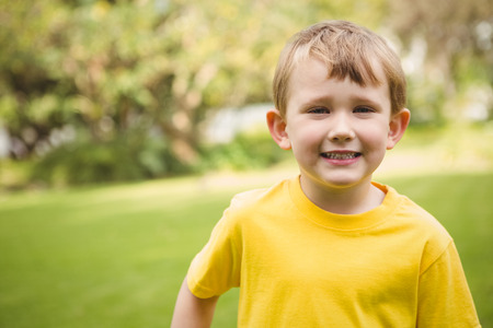 Smiling student looking at camera on the school grounds