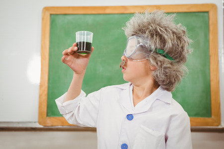 Student dressed up as einstein holding a beaker at the elementary school