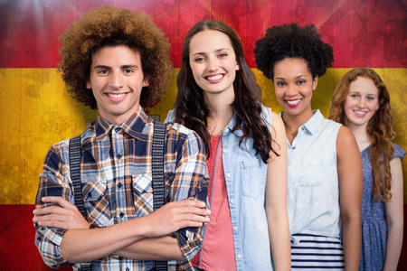 Confident and attractive fashion designers against spain flag in grunge effect