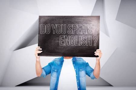 Casual man showing board against abstract roomの写真素材