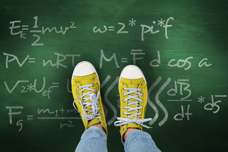 Casual shoes against green chalkboardの写真素材