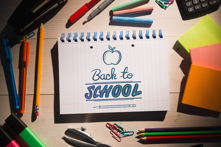 back to school against students table with school suppliesの写真素材