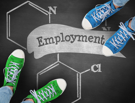 The word employment and casual shoes against black backgroundの写真素材