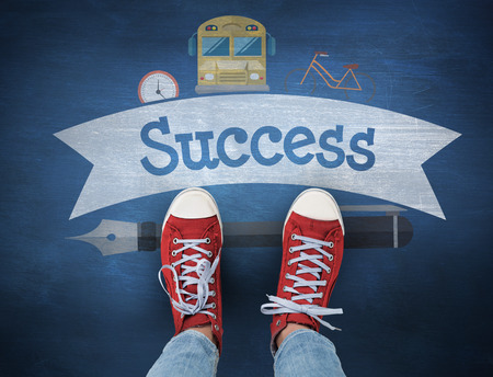 The word success and casual shoes against blue chalkboardの写真素材
