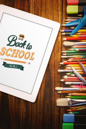 back to school against students desk with tablet pcの写真素材