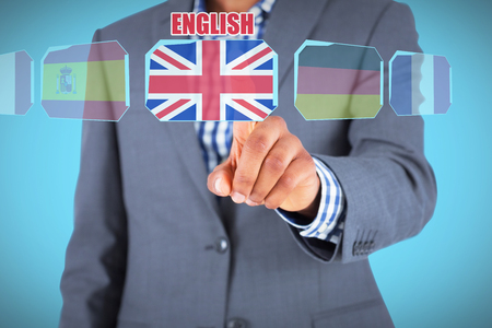 Focused businessman pointing against blue background with vignetteの写真素材