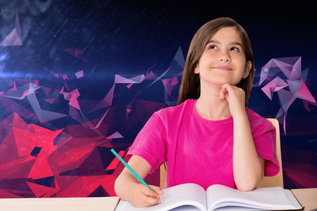 Cute pupil working at her desk against dark abstract design