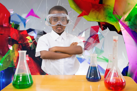 Pupil conducting science experiment against angular designの写真素材