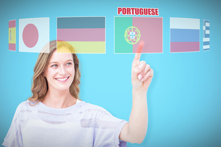 Pretty woman pointing with her finger  against blue background with vignette