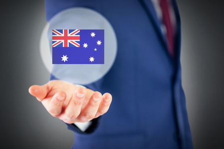 Close up view of businessman hand against grey backgroundの写真素材