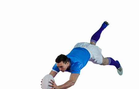 A determined rugby player scoring a tryの写真素材