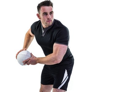 Rugby player throwing the ball on white backgroundの写真素材