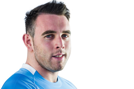 Tough rugby player looking at camera on white backgroundの写真素材