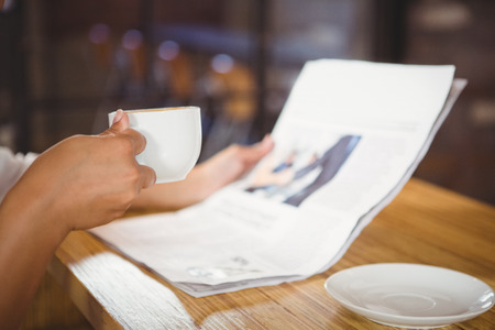 Casual businesswoman looking at files in a cafeの写真素材